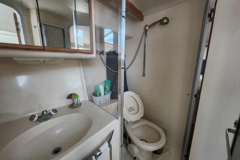 Slide: The Image of Bathroom interior of a 1996 Sea Ray 370 Sedan Bridge yacht. - 37