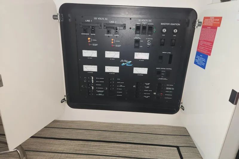 Slide: The Image of Electrical control panel of a 1996 Sea Ray 370 Sedan Bridge boat. - 42