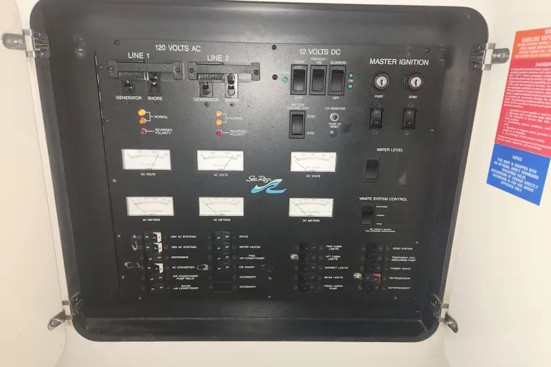 Slide: The Image of Electrical control panel of a 1996 Sea Ray 370 Sedan Bridge boat. - 43
