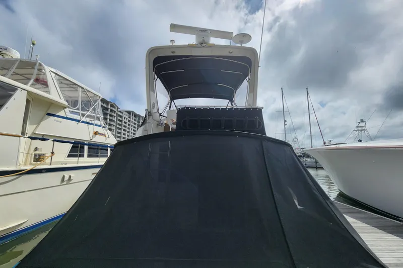 Slide: The Image of 1996 Sea Ray 370 Sedan Bridge docked at marina under cloudy sky. - 59