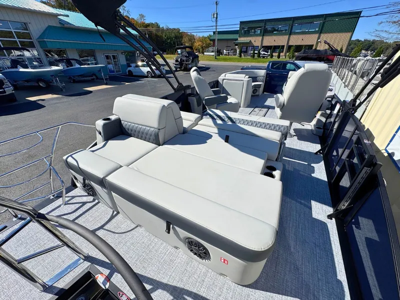 Slide: The Image of The image shows the deck of a 2027 Harris Cruiser 230 with comfortable seating. - 10