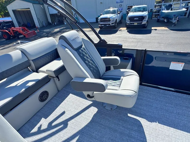 Slide: The Image of Interior of the Harris Cruiser 230 with a luxurious seat and gray carpet flooring. - 15