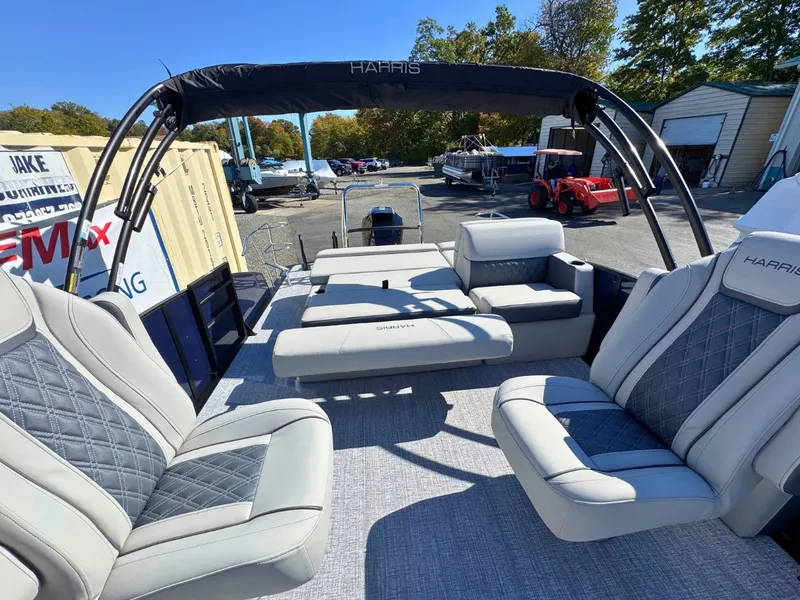 Slide: The Image of The image shows the interior of a 2027 Harris Cruiser 230 with luxurious seating. - 13
