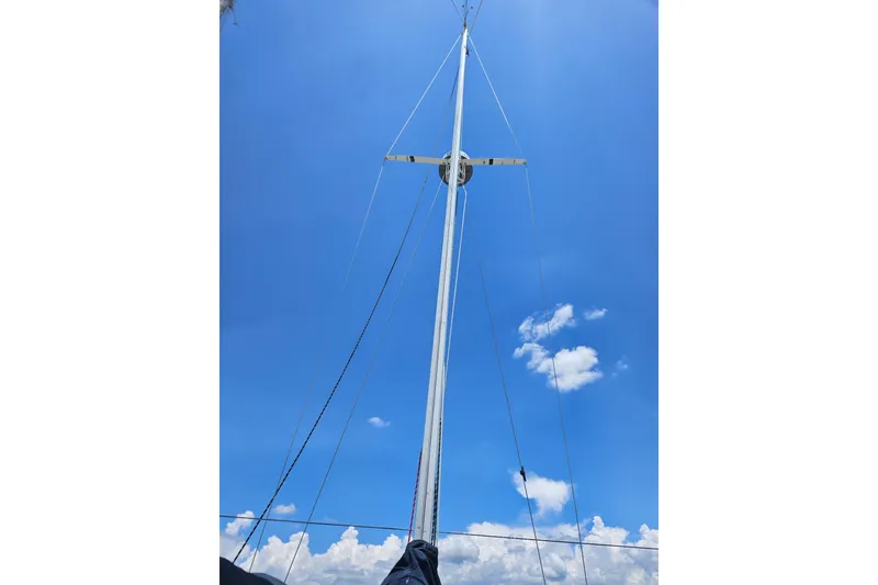 Slide: The Image of Sailboat mast against blue sky, C & C 29 SL, 1986 model. - 19