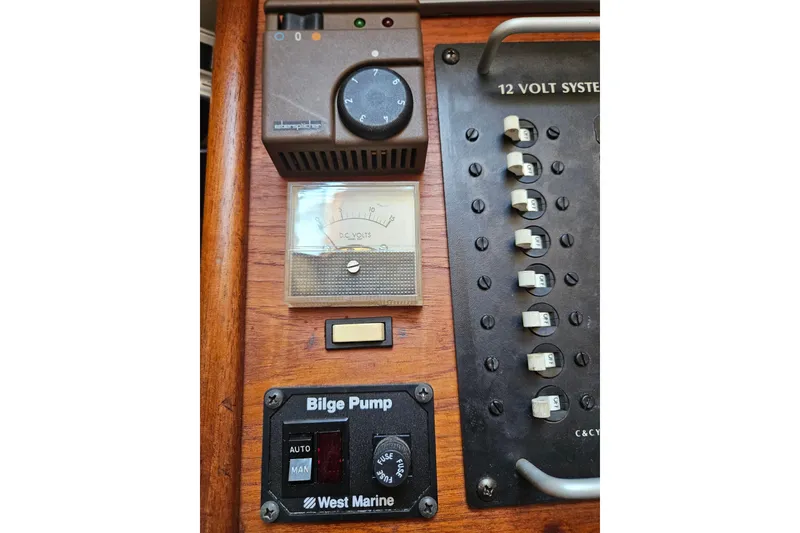 Slide: The Image of Control panel of a 1986 C & C 29 SL sailboat with bilge pump and voltmeter. - 30