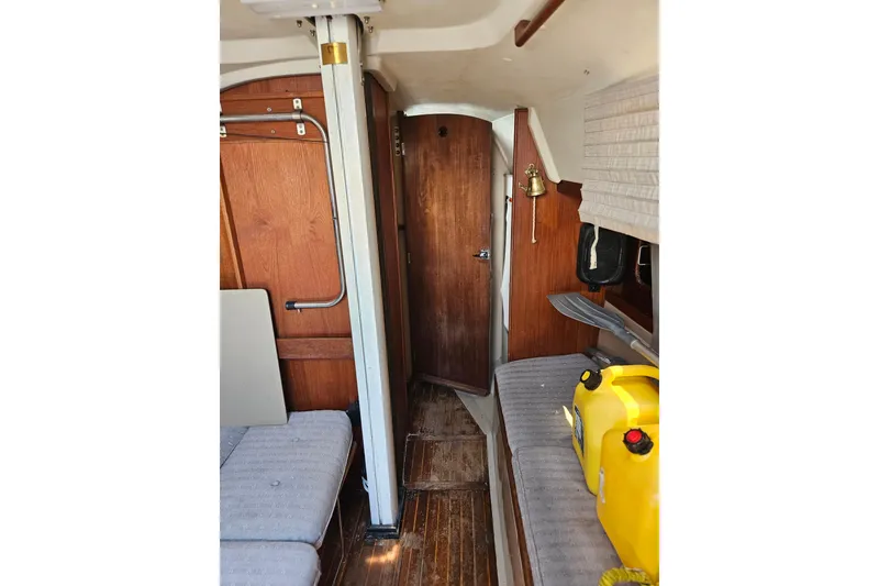 Slide: The Image of Interior of 1986 C & C 29 SL sailboat with wood paneling and seating. - 34