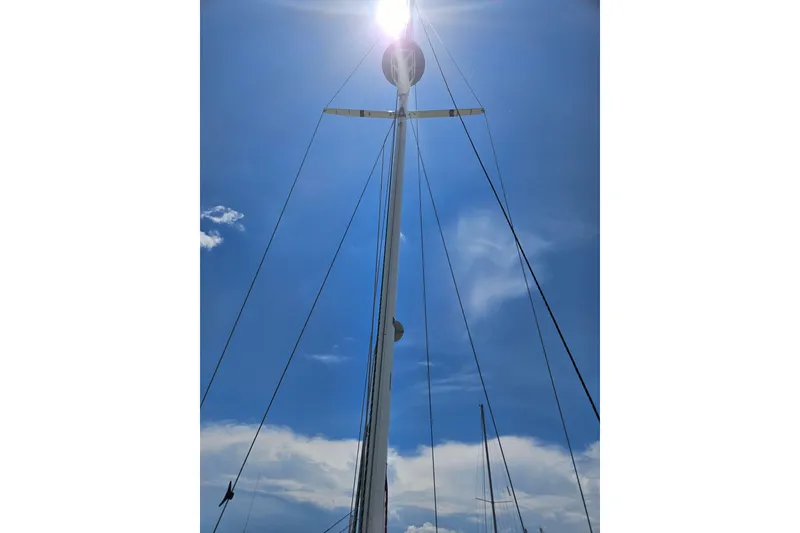 Slide: The Image of Sailboat mast of 1986 C & C 29 SL against a bright blue sky. - 40