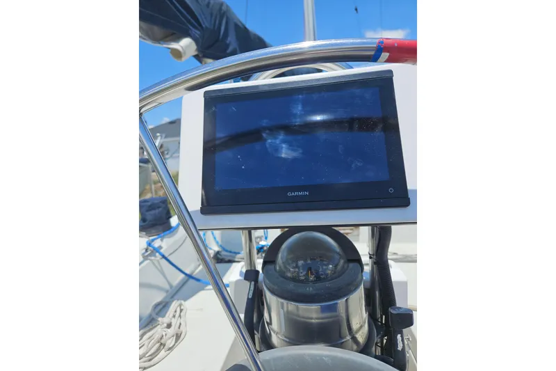 Slide: The Image of Garmin navigation system on 1986 C & C 29 SL sailboat, featuring compass and steering wheel. - 6