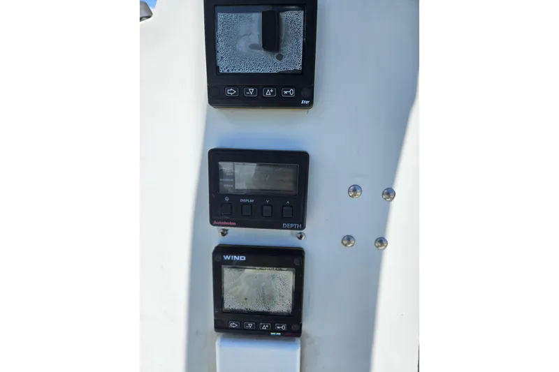 Slide: The Image of Instrumentation panel on a 1986 C & C 29 SL sailboat, featuring depth and wind displays. - 7