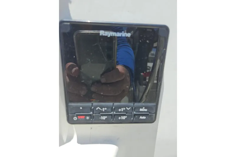 Slide: The Image of Raymarine control panel on 1986 C & C 29 SL sailboat, reflecting a person taking a photo. - 8