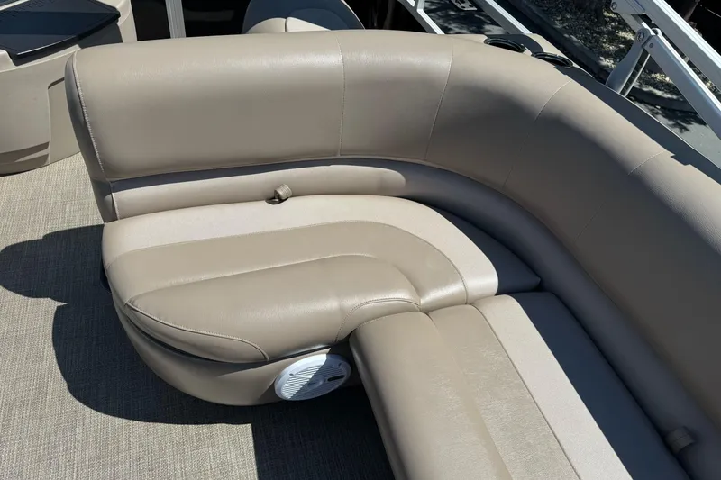 Slide: The Image of Beige leather seating on a 2020 Ranger 200F boat, featuring a built-in speaker. - 15