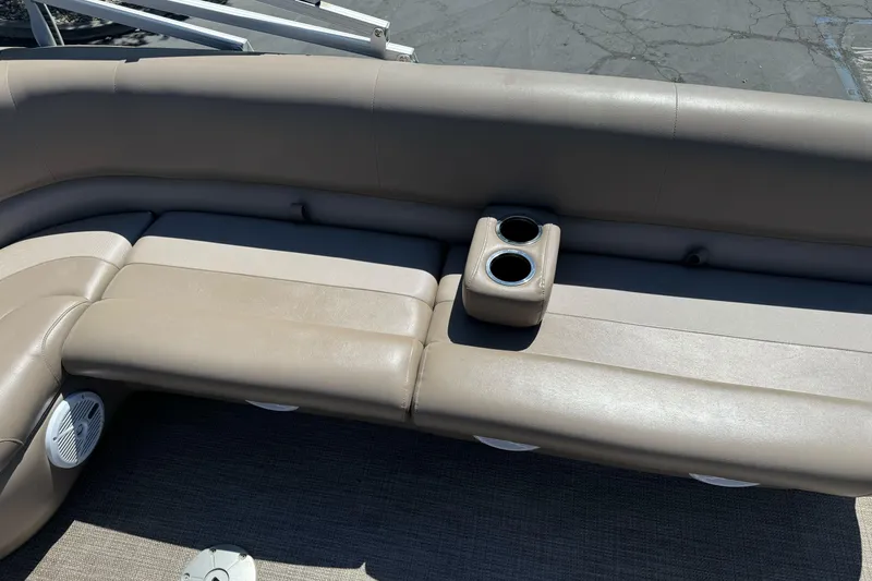 Slide: The Image of Beige seating with cup holders on a 2020 Ranger 200F boat. - 16