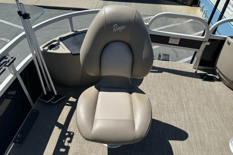 Slide: The Image of Ranger 200F 2020 boat seat with beige upholstery on deck. - 17