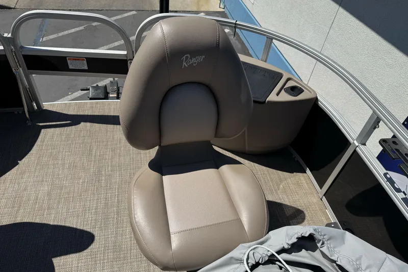 Slide: The Image of Captain's chair on a 2020 Ranger 200F boat, featuring beige upholstery and sleek design. - 18