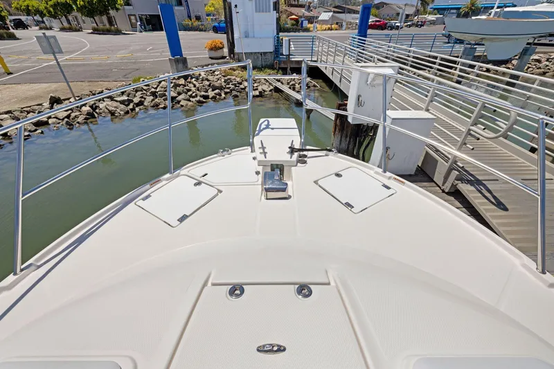 Slide: The Image of Bow view of 2022 Cutwater C-32 CB boat docked at marina. - 12
