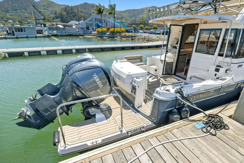 Slide: The Image of 2022 Cutwater C-32 CB boat docked with Yamaha outboard engines. - 3