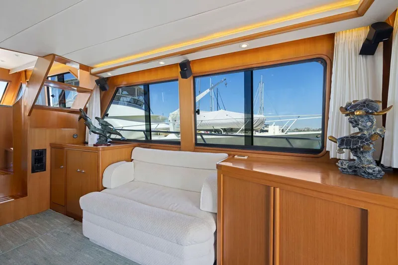 Slide: The Image of Luxurious 1999 Symbol 55 yacht interior with elegant wood finish and marina view. - 18