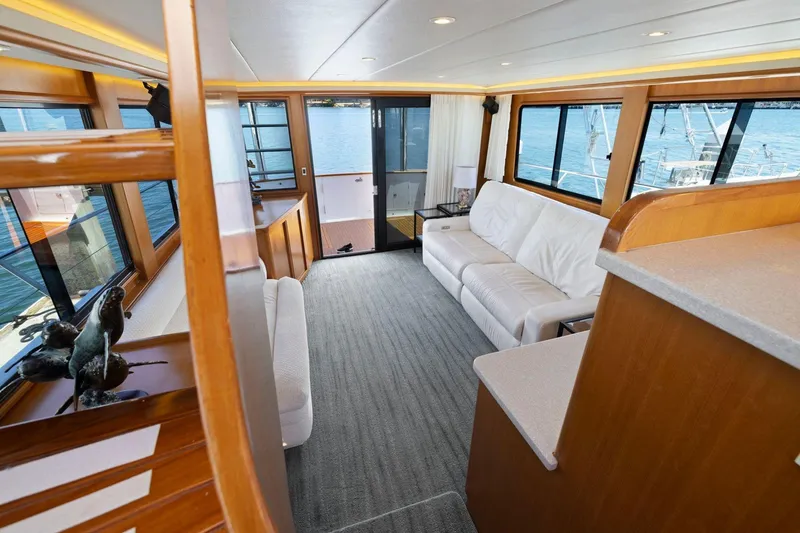 Slide: The Image of Luxurious interior of 1999 Symbol 55 yacht with white sofa and large windows. - 20