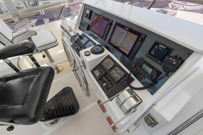Slide: The Image of Boat helm with navigation screens and controls, Symbol 55, 1999 model. - 59