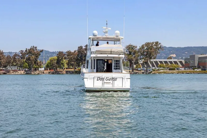 Slide: The Image of 1999 Symbol 55 yacht on water, trees and buildings in background. - 7