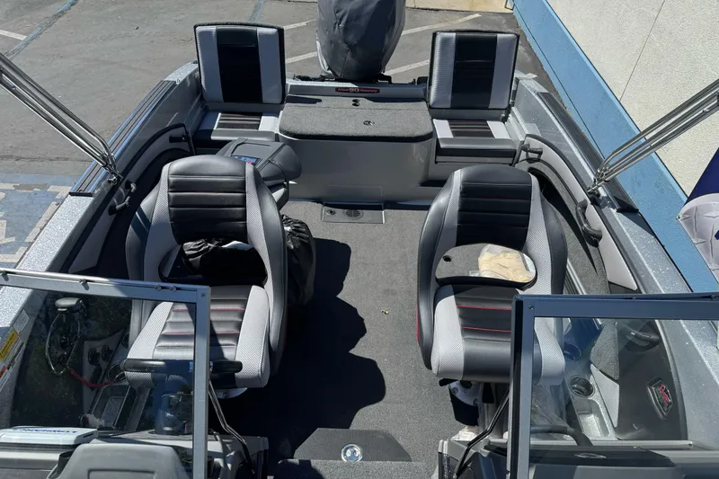 Slide: The Image of 2018 Ranger 1880MS boat interior with dual seats and modern design. - 13
