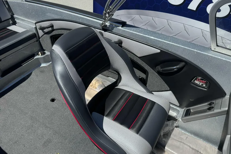 Slide: The Image of 2018 Ranger 1880MS boat interior with sleek black and gray seating. - 15