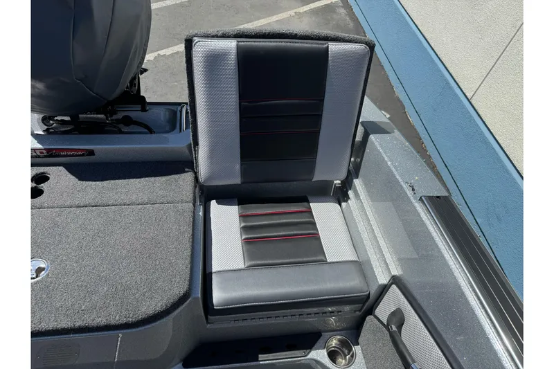 Slide: The Image of 2018 Ranger 1880MS boat seat with black and gray upholstery, cup holder nearby. - 19