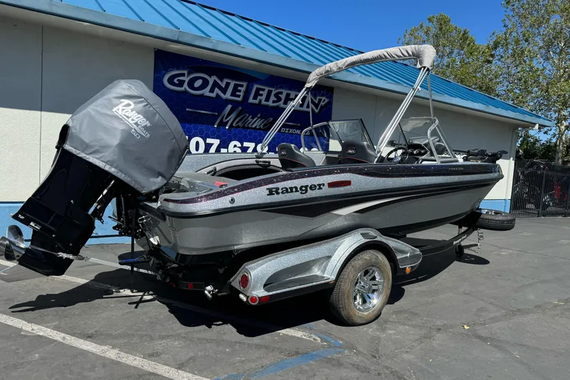 Slide: The Image of 2018 Ranger 1880MS boat parked outside Gone Fishin' Marine dealership. - 2