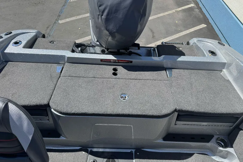 Slide: The Image of 2018 Ranger 1880MS boat interior with carpeted deck and seating area. - 22