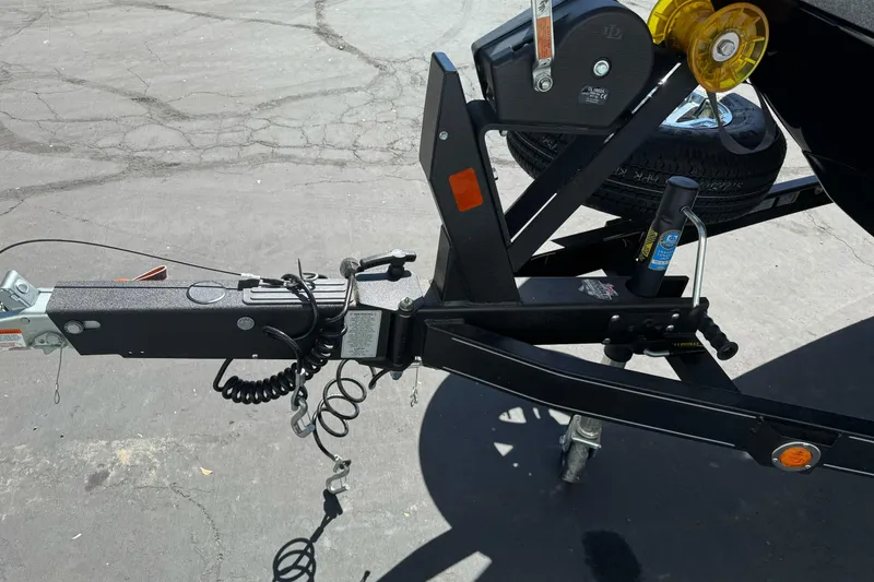 Slide: The Image of Trailer hitch of a 2018 Ranger 1880MS boat on pavement. - 4