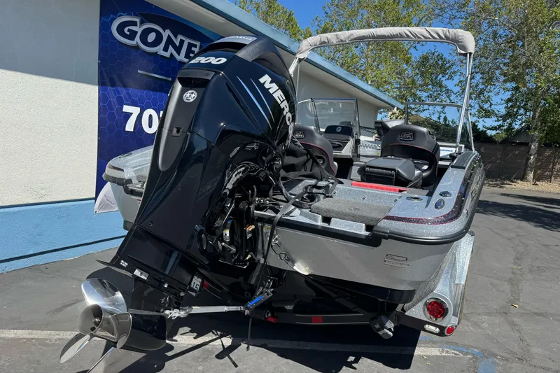 Slide: The Image of 2018 Ranger 1880MS boat with Mercury engine, parked outdoors. - 8