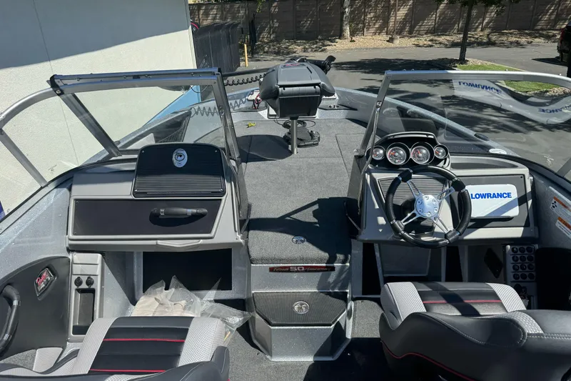 Slide: The Image of 2018 Ranger 1880MS boat interior with steering wheel, dashboard, and Lowrance electronics. - 9