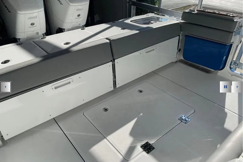 Slide: The Image of Interior view of 2025 Everglades 395 Center Console boat with seating and storage compartments. - 4