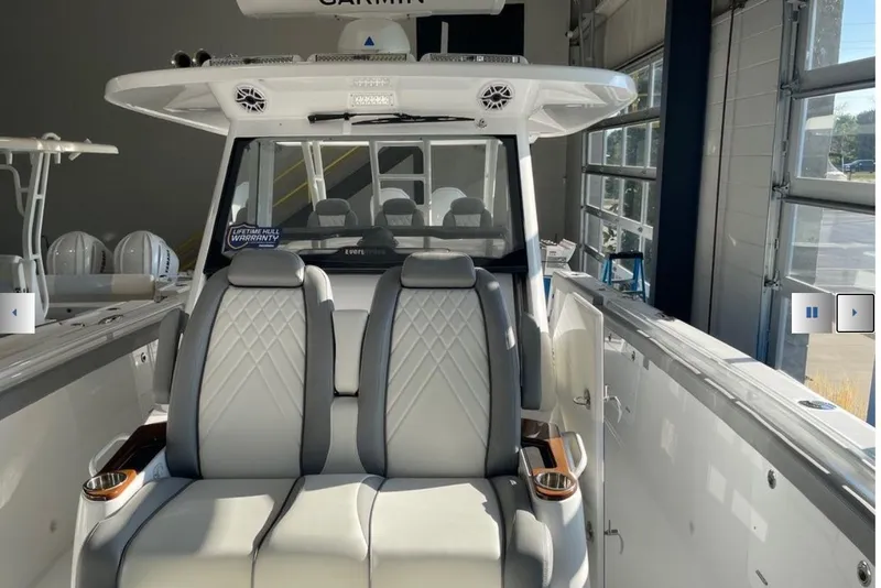 Slide: The Image of 2025 Everglades 395 Center Console boat interior with luxurious seating and modern design. - 5