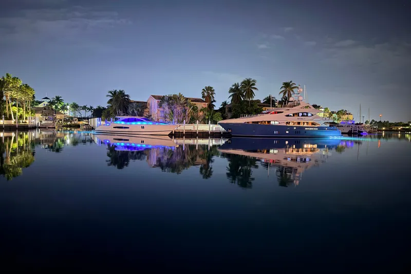 Slide: The Image of 2008 Lazzara LSX 75 yacht docked at sunset, calm waters, clear sky. - 1