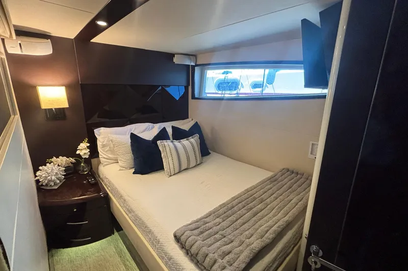 Slide: The Image of Luxurious bedroom interior of 2008 Lazzara LSX 75 yacht with elegant decor and window view. - 17