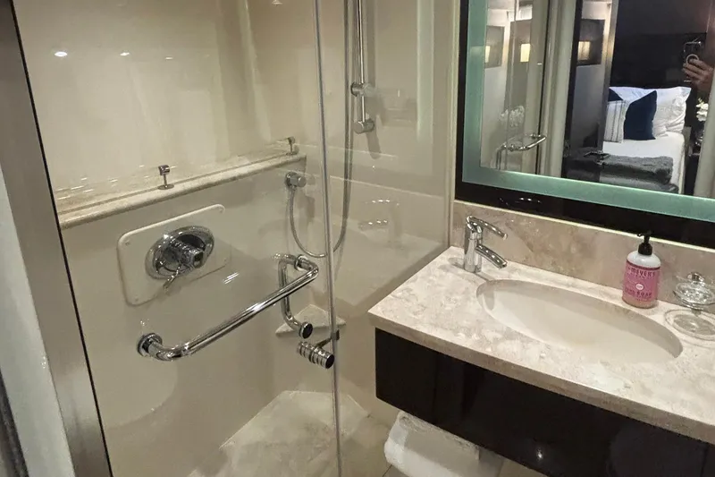 Slide: The Image of Luxurious bathroom in a 2008 Lazzara LSX 75 yacht, featuring modern fixtures and elegant design. - 21