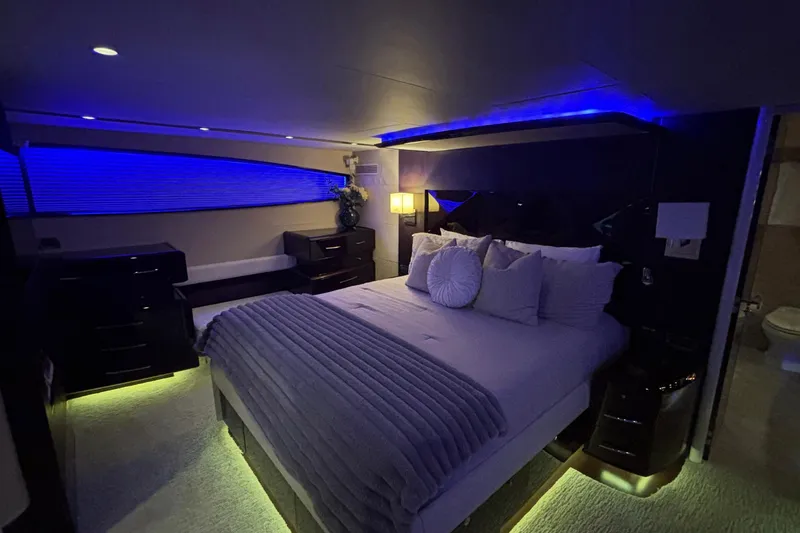 Slide: The Image of Luxurious bedroom interior of 2008 Lazzara LSX 75 yacht with ambient blue lighting. - 8