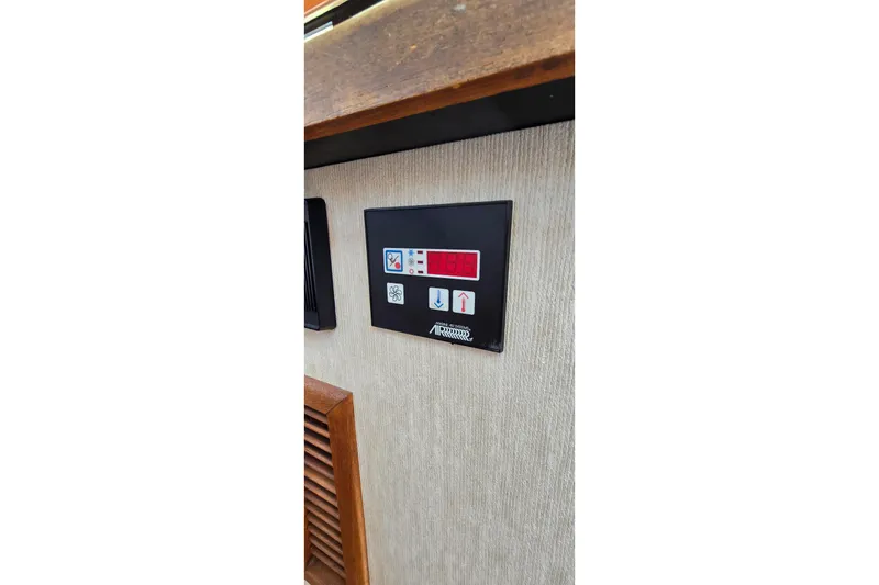 Slide: The Image of Control panel inside 1985 Carver 3207 Aft Cabin Motor Yacht, featuring digital display and buttons. - 18