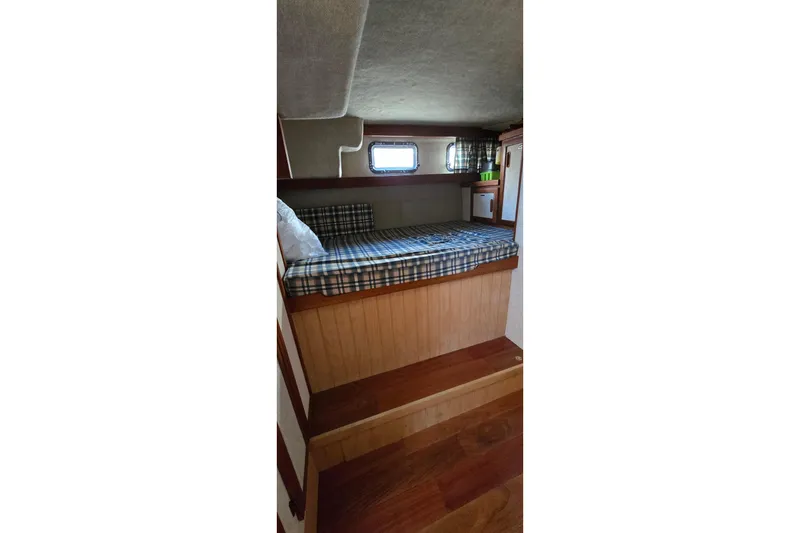 Slide: The Image of Interior cabin of 1985 Carver 3207 Aft Cabin Motor Yacht with plaid bedding. - 24