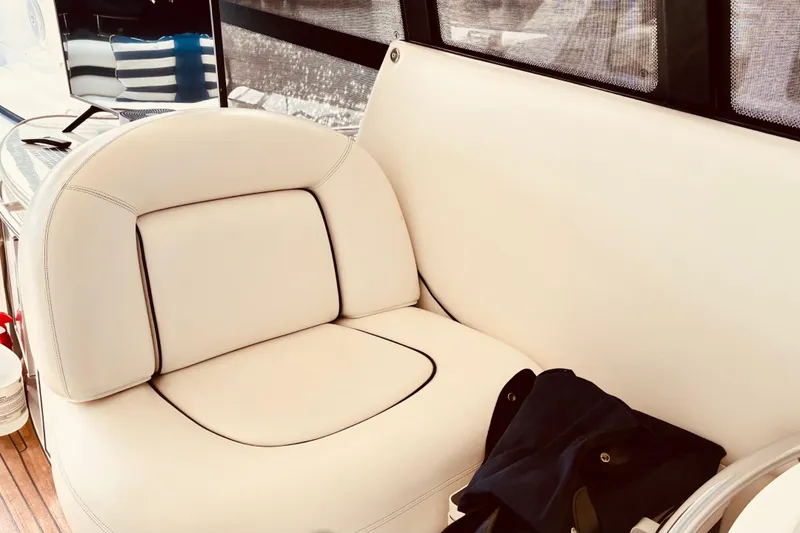 Slide: The Image of Luxurious white seating on a 2003 Sunseeker Predator 61 yacht interior. - 10