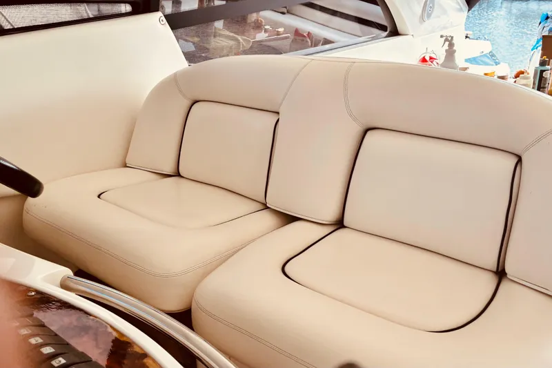 Slide: The Image of Luxurious beige seating on a 2003 Sunseeker Predator 61 yacht interior. - 11