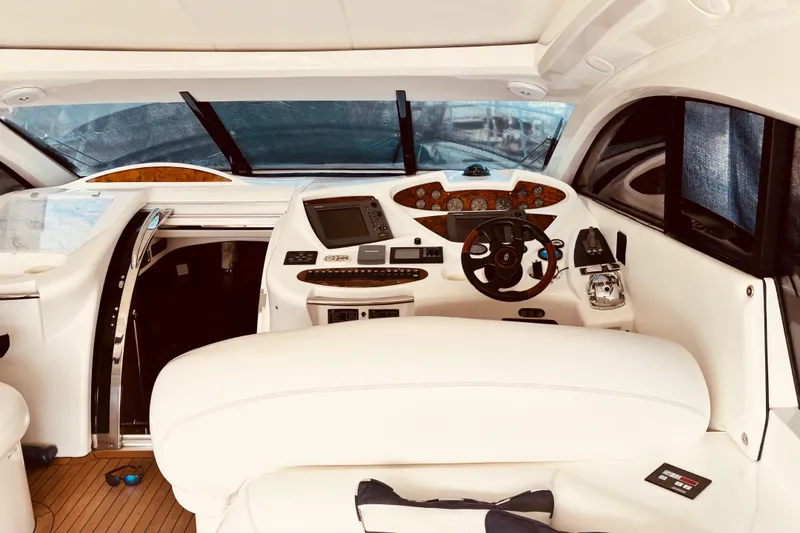 Slide: The Image of Interior of 2003 Sunseeker Predator 61 yacht with modern navigation controls. - 12