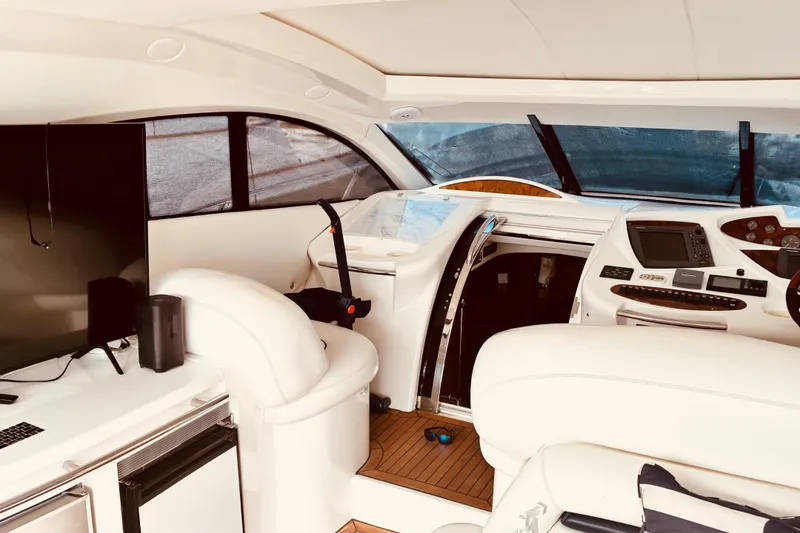 Slide: The Image of Interior of 2003 Sunseeker Predator 61 yacht with modern helm and luxurious seating. - 13