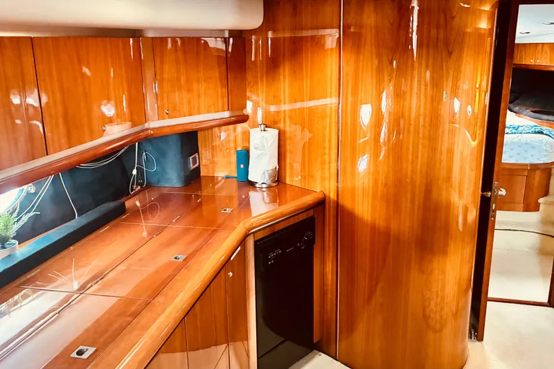 Slide: The Image of Luxurious wooden interior of 2003 Sunseeker Predator 61 yacht cabin. - 16