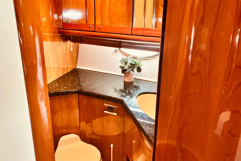 Slide: The Image of Luxurious wooden interior of 2003 Sunseeker Predator 61 yacht bathroom with elegant fixtures. - 18