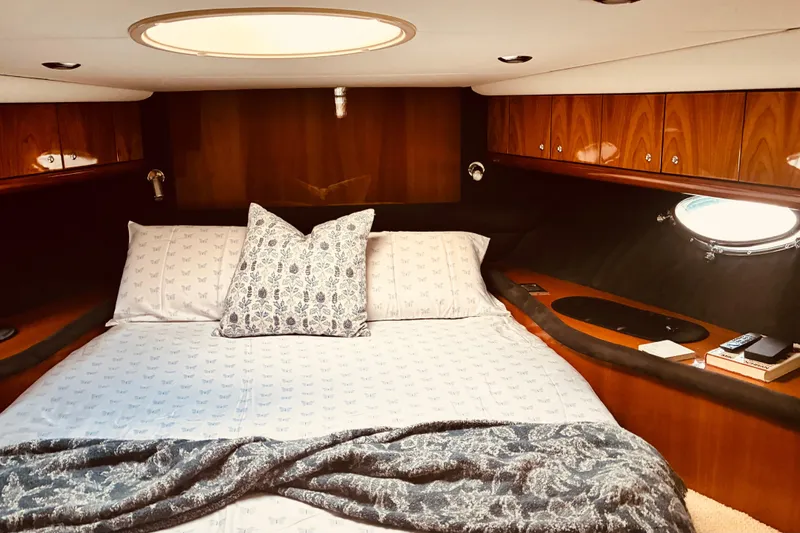 Slide: The Image of Luxurious cabin interior of 2003 Sunseeker Predator 61 yacht with elegant bedding. - 20