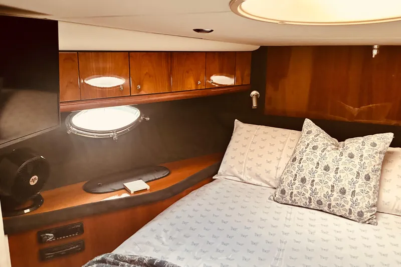 Slide: The Image of Luxurious cabin interior of 2003 Sunseeker Predator 61 yacht with elegant bedding. - 21