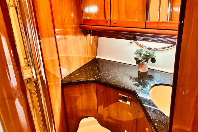 Slide: The Image of Luxurious wooden bathroom interior on a 2003 Sunseeker Predator 61 yacht. - 26