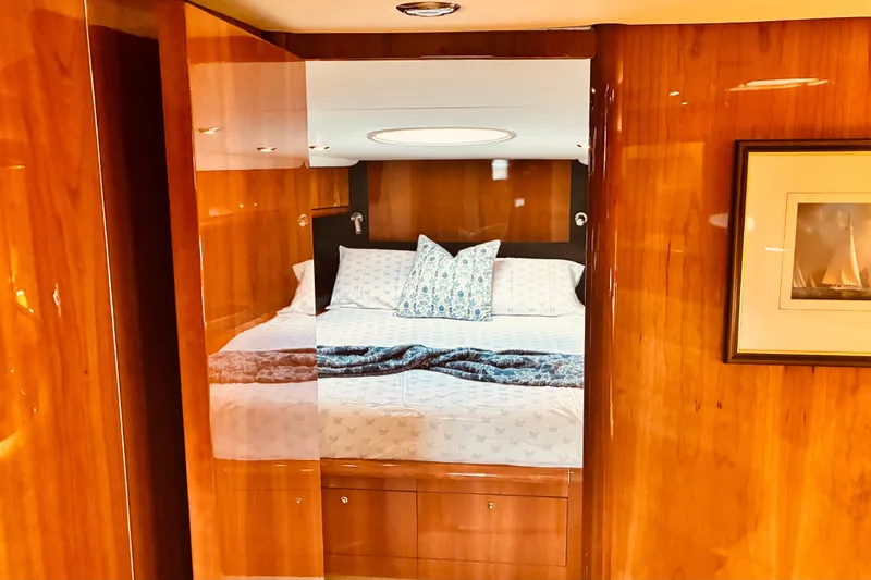 Slide: The Image of Luxurious cabin interior of 2003 Sunseeker Predator 61 yacht with polished wood finish. - 27